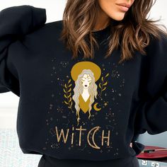 Introducing our enchanting Witch Sweatshirt! Made with the finest witchy vibes, this comfortable tee is perfect for those who love a touch of magic. Crafted from super soft fabric, it'll keep you cozy as you conjure up your own spells and brew potions. With its bewitching design, this shirt is a must-have for any witchy wardrobe. Get ready to cast your stylish spell with our Witch Sweatshirt! 💫CLOTHING DESCRIPTION A unisex heavy blend hooded sweatshirt made with a thick blend of cotton and polyester, it feels plush, soft and warm, a perfect choice for any cold day. There are no side seams. In the front, the spacious kangaroo pocket adds daily practicality while the hood's drawstring is the same color as the base sweater for extra style points.  .: 50% cotton, 50% polyester .: Medium-heavy Witchy Wardrobe, Witch Clothing, Witch Sweatshirt, Gothic Witch, Witches Brew, Witchy Woman, Witchy Vibes, Look Plus, Halloween Witch