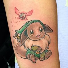 a small tattoo of a pikachu with a green hat on it's head