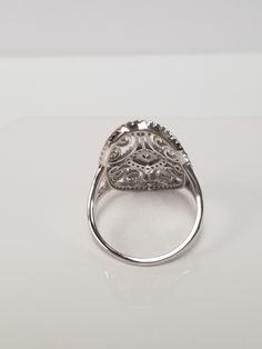 "Thanks for shopping our vintage estate store. We tend to sell well below wholesale and truly hope you enjoy all of our items. Many of the items are one of a kind, so please enjoy scrolling through the pictures and hopefully something will catch your eye. Black spots are from reflections. Nice estate sterling silver 925 .25ct Cz Diamond gem stone filigree cocktail ring. An estate ring, came from a jewelry store that was closing. Ring size: 7 or 8 Setting: 7/8\" by 5/8\" Band width: 1.5mm Weight: Classic Collectible Diamond Ring With Center Stone, Classic Sterling Silver Cluster Ring, Classic Sterling Silver Cluster Ring In Diamond White, Vintage Silver Filigree Ring With Diamond Accents, Classic Filigree Ring With Diamond Accents, Classic Collectible Rings With Diamond Accents, Classic Collectible Diamond Ring With Vvs Clarity, Classic Silver Cluster Ring With Prong Setting, Classic Rings With Diamond Accents For Collectors