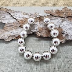 "Beautiful! 🛑 BEFORE CHOOSING YOUR LENGTH/SIZE PLEASE READ **ENTIRE** DESCRIPTION 🛑                               These VERY LARGE beads affect INSIDE circumference (what your wrist measures with a string/ribbon/measuring tape) which affects OUTSIDE circumference.  VERY large, shiny 14mm round ball sterling silver bead bracelet.                                                          🚩 🚩 🚩  IMPORTANT  IMPORTANT  THE BIGGER THE BEADS, THE MORE LENGTH REQUIRED for a good fit. EXAMPLE:  If yo Silver Beaded Bracelets With Ball Chain, Silver Beaded Bracelet With Ball Chain As Gift, Silver Beaded Ball Chain Bracelet, Sterling Silver Beaded Bracelets With 8mm Beads, Silver Beaded Bracelets With Polished Beads, Silver Bracelets With Spacer Beads, Sterling Silver Bracelets With Ball Chain And Round Beads, Sterling Silver Bracelets With Ball Chain, Sterling Silver Bracelet With Spacer Beads