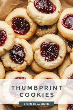 some cookies with jam on them and the words thumpprint cookies