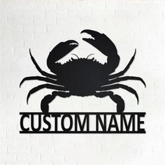 a metal sign that says custom name with a crab on it