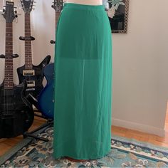 Nwt Forever 21 Green Chiffon Skirt. Size S. Chiffon Maxiskirt With Side Slits Over Opaque Mini Liner. Waist: 24" Unstretched, But Stretches Up To 30"; Hips (Hem Of Underskirt): 35" All Items Are Considered In Excellent Wearable Condition, Unless Otherwise Mentioned And Shown In Pictures. Orders And Payment Are Only Accepted Through Poshmark. If You Would Like Measurements, More Pictures, Or Any Other Info, Please Ask Before Purchasing. We Do Not Accept Returns Or Do Partial Refunds, But We Very Summer Stretch Maxi Skirt With Split Design, Stretch Summer Skirt With Split Design, Summer Midi Skirt With Side Slits, Summer Maxi Skirt With Side Slits, Relaxed Split Maxi Skirt With Lining, Summer Pencil Skirt With Split Design, Summer Skirt With Side Slits For Night Out, Split Design Pencil Skirt For Summer, Summer Fitted Maxi Skirt With Split Design