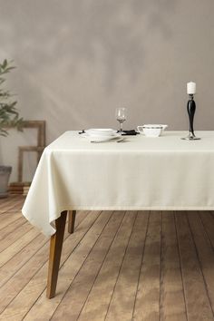 a white table cloth with two plates on it