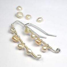 Genuine freshwater cultured beautiful pearls adorn these sterling silver wire wrapped threader earrings. Elegantly playfully, comfortable to wear, and will compliment any outfit or occasion. Lightweight and easy to put on and take off. The pearls are securely encased in wire and add such a whimsical element to the overall design of the earrings. For more unusual quixotic jewelry designed with style and grace please visit my shop: www.etsy.com/shop/BellaVivoJewelry Your set of earrings will arriv Bar Jewelry, Sterling Silver Wire Wrap, Threader Earrings, Style And Grace, Wire Earrings, Organza Bags, Earrings Silver, Silver Wire, Pearl Jewelry