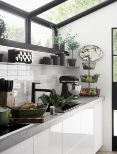 an instagram photo of a kitchen with pots and pans on the counter top