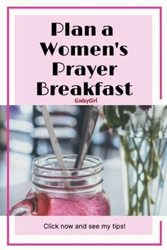 a mason jar filled with pink liquid next to a vase full of flowers and spoons