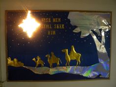 a nativity scene with three wise men riding camels