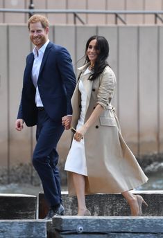 prince harry and his wife, the duke of cambridge, are walking down steps together