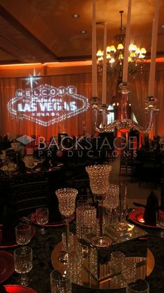 an elegant dining room with chandelier and candles