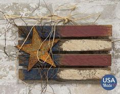 an american flag made out of wooden planks with a rusty star on the top