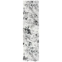 a white and black area rug on a white background