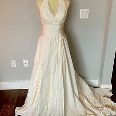 This Is A Stunning Wedding Gown. It Has Been Worn. Dry Cleaned But Has Been In Its Original Bag Since So Need To Be Cleaned Again. It Is More Of A Cream Than A Bright White. Size 6, Not Altered At All. Beautiful Train That Can Be Busseled Up. There Are Some Areas On Bottom Of Dress That Can Be Dry Cleaned Out. See Picture. Amazing Quality And Beautiful Design.No Tears Or Rips. Animal And Smoke Free Home. Wedding Gown Color, Original Bags, Wedding Gown, Bright White, Wedding Gowns, Beautiful Design, Dresser, Wedding Ideas, Wedding Dresses