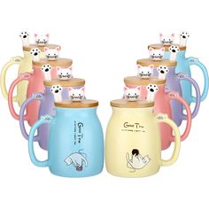 many different colored mugs with cats on them