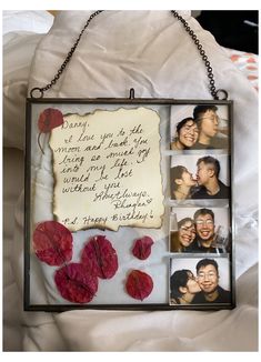 a photo frame with four photos and a message attached to it, hanging on a chain