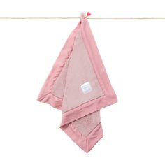 a pink towel hanging on a clothes line with a tag attached to the end of it