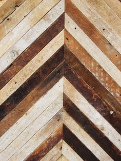 the corner of a wooden wall made out of boards