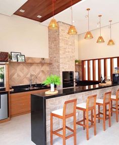 a kitchen with an island and bar stools