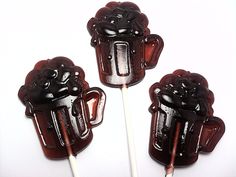 three chocolate covered lollipops sitting on top of each other