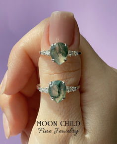 Elevate your look with the "Fern" ring, featuring a captivating Moss Agate gemstone and sparkling White Topaz. The Moss Agate, with its intricate moss-like inclusions, evokes the serenity of a forest glade, while the White Topaz adds a touch of sparkle reminiscent of morning dewdrops. This ring is a wearable work of art, capturing the enduring beauty of nature. Adjustable Moss Agate Gemstone Jewelry, Elegant Moss Agate Ring With Natural Stones, Moss Agate Ring With Natural Stones, Nature-inspired Diamond Gemstone Jewelry, Unique Tourmaline Jewelry With Accent Stones, Nature-inspired Agate Rings With Natural Inclusions, Mystical Green Gemstone Jewelry, Nature-inspired Gemstone Rings For May Birthstone, Nature-inspired Rings With May Birthstone Gemstone