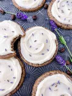 several cookies with frosting and lavender sprinkles