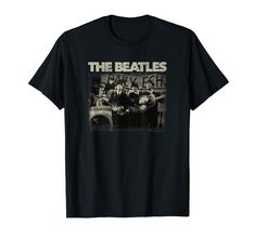 the beatles t - shirt with an image of two men standing in front of a car