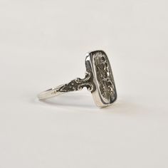 925 sterling silver Finger size US 7.5* Made from vintage methods and instruments in recycled gold by Hugo Kohl and team in his Harrisonburg, VA studio. *This ring can be re-sized to sizes ranged 5-8 For an additional $20. If you would like to have this ring sized please send us a message. About Hugo Kohl Hugo Kohl's Harrisonburg, VA workshop utilizes one of the worlds' largest collections of antique jewelry dies, hubs, and rolls from the iconic early industrial age to make expert vintage reprod Classic Sterling Silver Engraved Ring With Open Band, Classic Sterling Silver Engraved Open Band Ring, Silver Art Deco Signet Ring With Polished Finish, Art Deco Silver Signet Ring With Polished Finish, Heirloom Hallmarked Adjustable Stackable Rings, Heirloom Adjustable Hallmarked Stackable Rings, Adjustable Heirloom Hallmarked Stackable Rings, Antique Silver Engraved Ring, Vintage Silver Engraved Ring