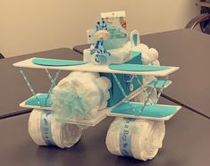 a baby carriage made out of diapers sitting on top of a table