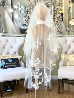 This floral blusher wedding veil is stunning! It's features romantic sequin rose appliqués beautifully placed along the gentle curve of this waltz length veil. The floral lace trim appliqués begin just below the shoulders. Dramatic and easy to wear a waltz length veil is a perfect complement to any gown style. Waltz length veils / 54 inches hit just at the back of the knee on an average height bride. Shown in Light Ivory but available in many colors of tulle. PICTURED: Veil the picture is 54 inc White Floral Veil, Embroidered Blusher Veil, White Wedding Veil With Floral Embroidery, White Floral Embroidered Wedding Veil, 3d Floral Veil, Rose Veil, Lace Trimmed Veil, Drop Veil, Flower Veil