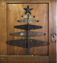 a wooden door with an iron christmas tree on it