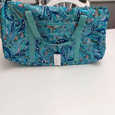 Lighten Up Is Water Resistant And Wipe Clean. Large Duffel Measures About 21w X 11h With Slip Pocket On Each End, Front Zip Pocket And Adjustable Shoulder Strap. Interior Slip Pockets. Everyday Use Bags With Paisley Print, Vera Bradley Duffel, Travel Jewelry Holder, Vera Bradley Duffle Bag, Vera Bradley Lunch Bags, Vera Bradley Duffel Bag, Vera Bradley Weekender Bag, Floral Print Double Handle Travel Bag, Jewelry Roll Travel