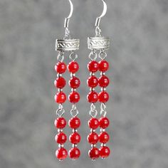 This double stand necklace is handmade using coral; Coral red, a powerful and bold color that captures the viewer's attention. One's eye will always gravitate to where the red is. The length of the necklace is 20-23 inches, or 50-58 cm. It is well suited to crew and high necklines, but can equally add a frame to a plunging neckline. This length looks great with a tailored jacket. The V-shape lariat elongates our neckline and siphones attention to our face. It is easy to wear, it is comfortable t Elegant Adjustable Red Coral Necklace, Spiritual Red Coral Jewelry As A Gift, Red Coral Round Necklace For Gift, Round Red Coral Necklace For Gift, Elegant Red Dangle Jewelry, Elegant Coral Jewelry For Anniversary, Spiritual Red Jewelry For Anniversary, Red Coral Necklace With Lobster Clasp As Gift, Adjustable Red Coral Jewelry