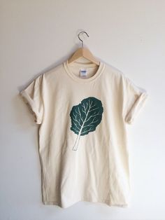 Kale Screen Printed T Shirt, Kale Shirt Food Graphic Tee, Organic Cotton Crew Neck T-shirt, Eco-friendly Green Cotton T-shirt, Green Eco-friendly Crew Neck T-shirt, Organic Cotton Crew Neck Tops, Eco-friendly Green Crew Neck T-shirt, Hand Printed Relaxed Fit Organic Cotton T-shirt, Green Organic Relaxed Fit T-shirt, Hand Printed Organic Cotton T-shirt, Relaxed Fit