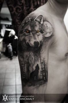 an arm with a wolf on it and some trees in the background that is black and white