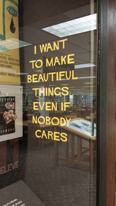 a sign is on the window of a book store that says i want to make beautiful things even if nobody cares