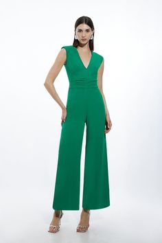 {@@=Ist.Core.Helpers.StringHelper.ToProperCase("Experience truly re-wearable occasionwear with our jumpsuit. This piece features a deep, plunging V neckline, which points to ruched detailing at the waist that cinches the silhouette, and ultra wide legs. Styles well with anything, from heeled ankle boots to strappy sandals for looks that will see you from party nights to evenings out. Fluid Tailored Ruched Waist Detail Wide Leg Jumpsuit Ultra Flattering Wide Leg Fit Statement Plunge Neckline Cont Sleeveless Solid Ruched Jumpsuits And Rompers, Elegant Ruched Jumpsuits And Rompers For Spring, Hen Do Outfits, Bride Jumpsuit, Workwear Capsule Wardrobe, Plus Size Workwear, Summer Bridesmaid Dresses, Outfits For Mexico, Spring Wedding Guest Dress