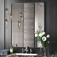 a bathroom with marble counter tops and two sinks in front of a striped wall mirror