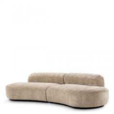 a beige couch sitting on top of a white floor