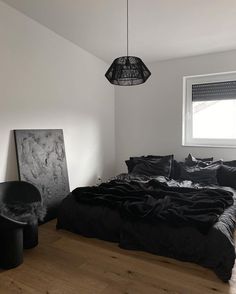 a black and white photo of a bedroom