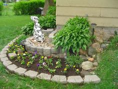 a dalmatian dog sitting on top of a flower bed