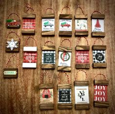 christmas ornaments are hanging on a wooden table with twine and twine around them