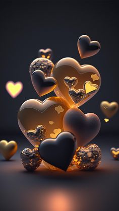 many hearts are floating in the air on a dark surface with light coming from them