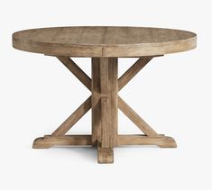 a round wooden table with four legs