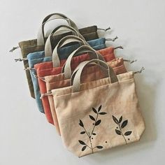 five bags with different designs on them sitting next to each other