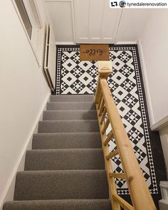 the stairs are decorated with black and white tiles