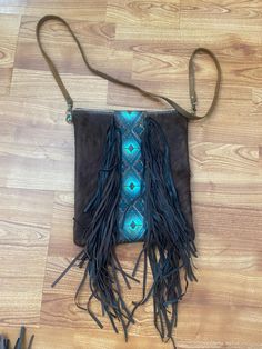 Southwestern blue and brown embossed leather and cowhide shoulder bag with genuine leather fringe. New, handmade. Unique gift for women10x11 in. 40 in leather shoulder strap. Zipper w/ cotton fabric lining. Unique Gifts For Women, Blue And Brown, Leather Fringe, Gift For Women, Embossed Leather, Purses And Handbags, Gifts For Women, Shoulder Strap, Genuine Leather