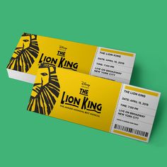 two tickets for the lion king are shown in yellow and black on a green background