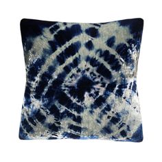 a blue and white tie - dyed pillow with an intricate design on the front side