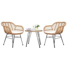 two wicker chairs and a table with a vase on it, both sitting next to each other