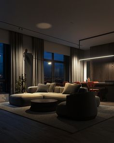 a living room filled with furniture next to a large window covered in dark colored curtains